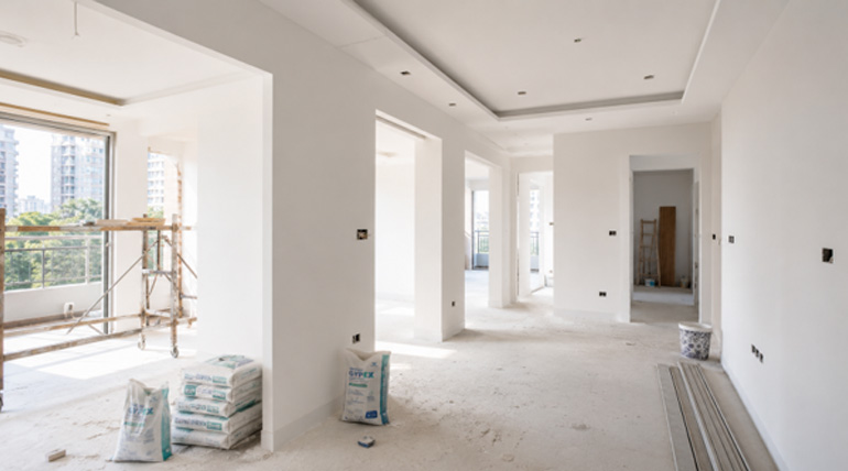 Cost-effective wall plastering site with zero curing wait time for faster project completion using sustainable wall plaster.